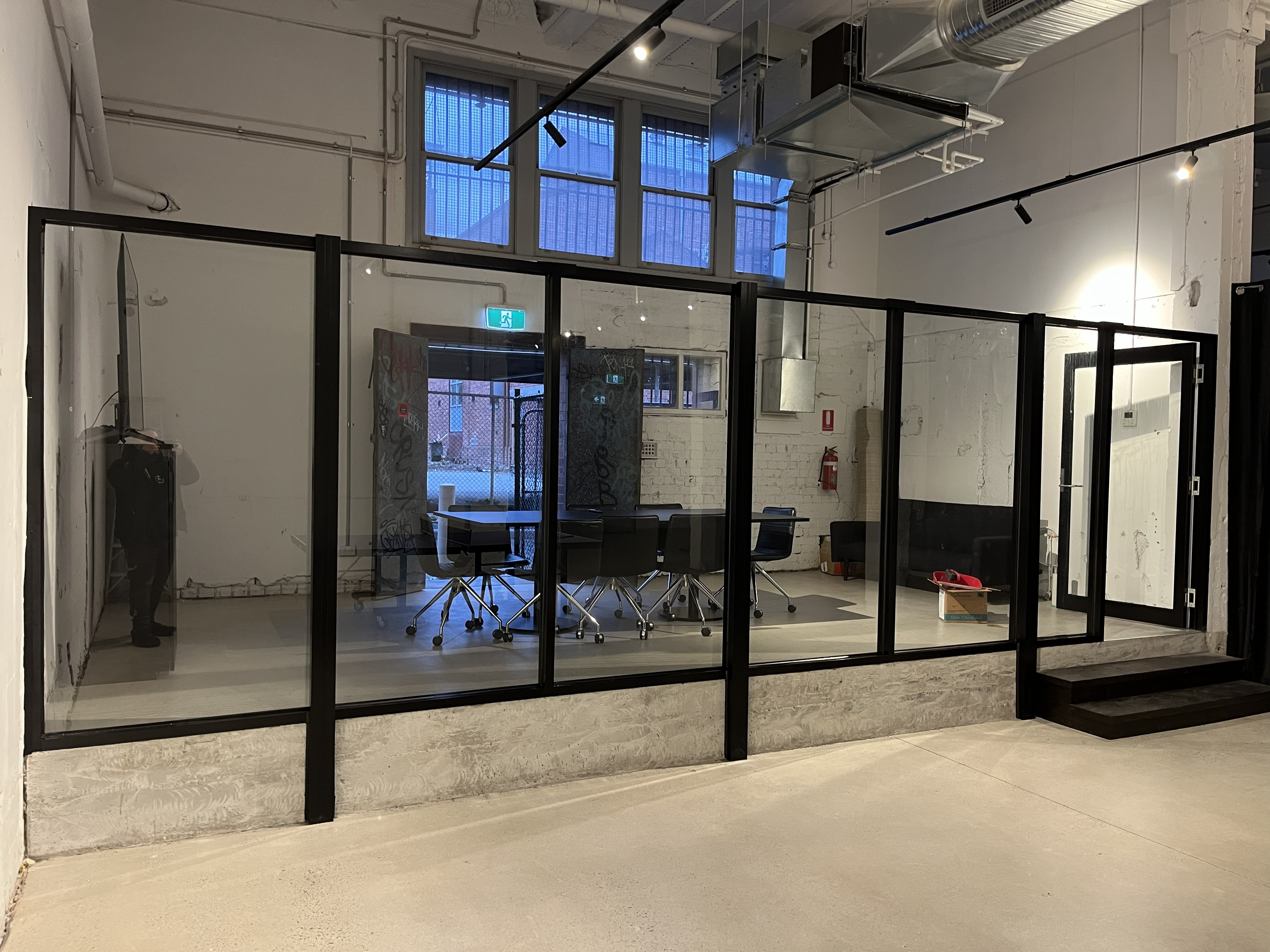 Office partition glazing along a corridor